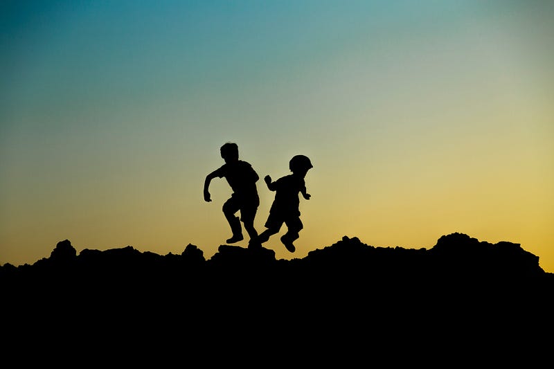 Children playing in a field, reflecting on a hopeful future