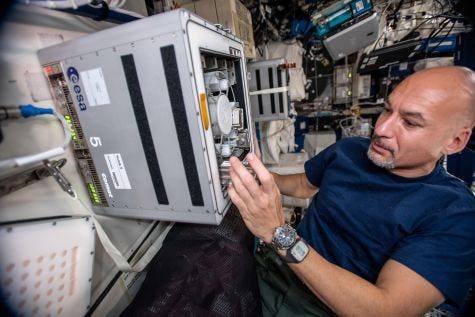 Astronaut conducting bacterial mining research