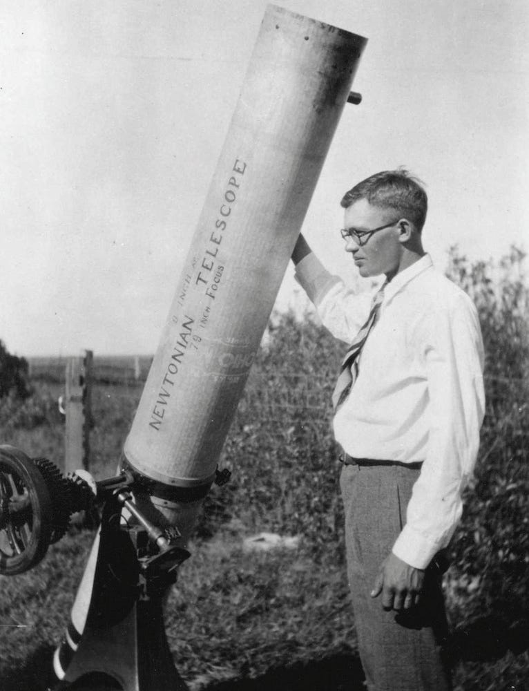 Clyde Tombaugh with his telescope