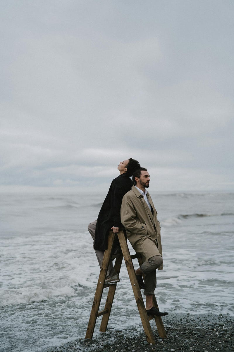 Person standing at the shore symbolizing flexibility